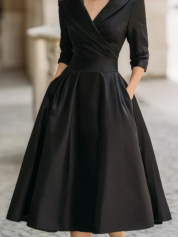 Elegant Midi Dress with Refined Details and Practical Pockets
