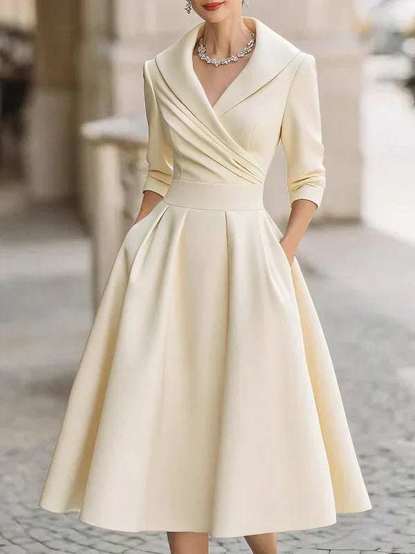 Elegant Midi Dress with Refined Details and Practical Pockets