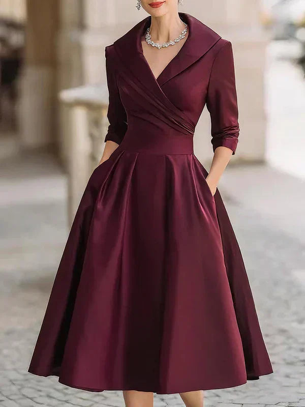 Elegant Midi Dress with Refined Details and Practical Pockets